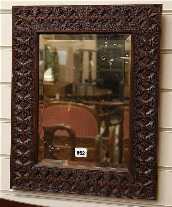 A carved framed teak wall mirror H.50cm